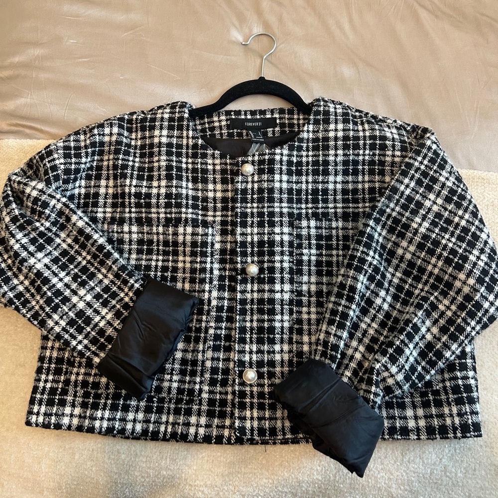 Black and white cropped jacket with pearl buttons